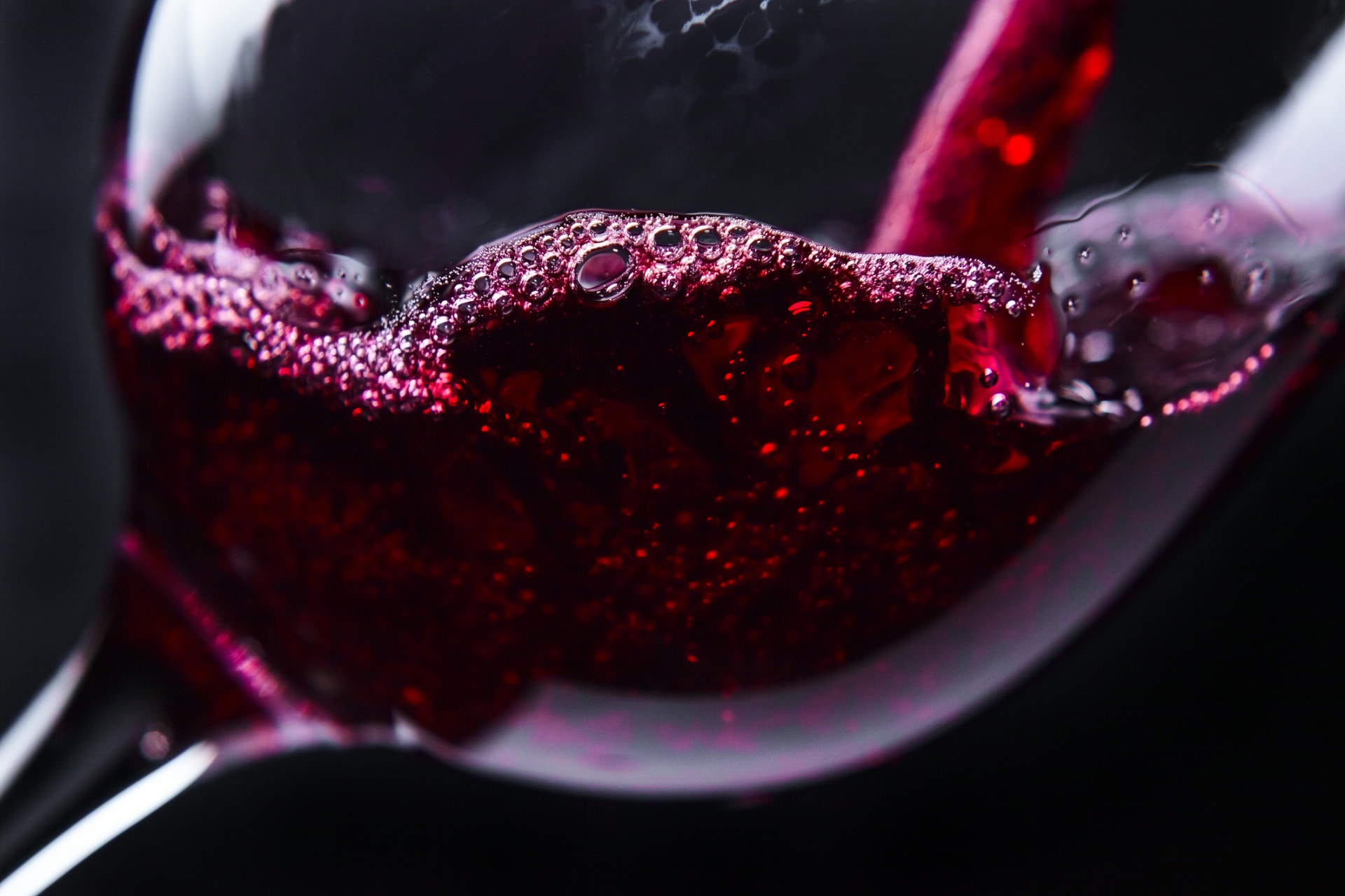 Red wine swirling in a glass